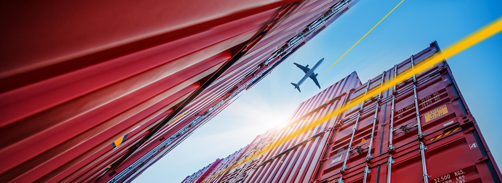 Aircraft flies over shipping container