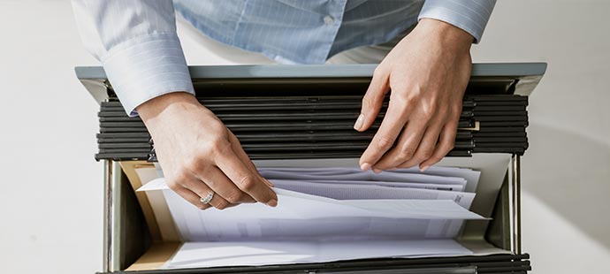 Person At Filling Cabinet LGI General Terms